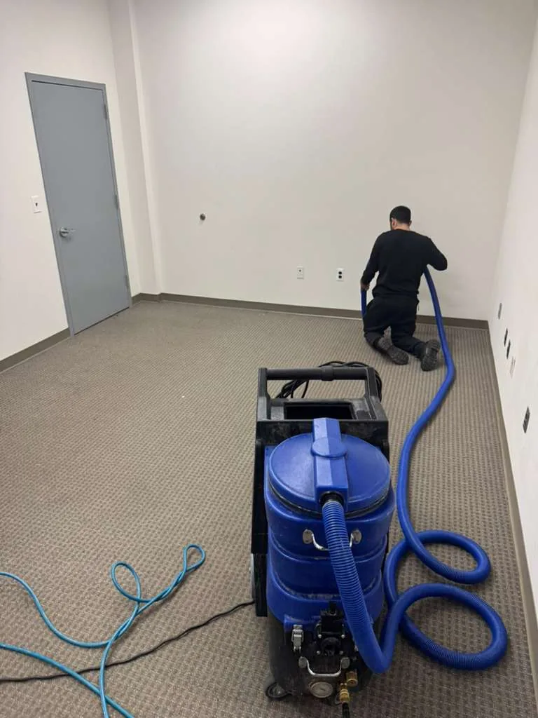 GCC technician steam-cleaning a carpet in Maryland